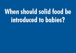 When should solid food be introduced to babies?